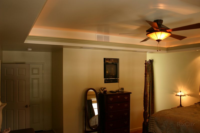 BHG 010.jpg - The tray ceiling is trimmed with cove molding and rope lighting behind it.